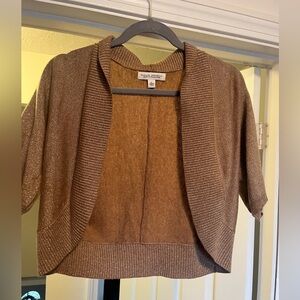Gold shrug